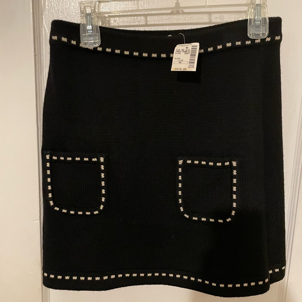 Womens black sweater, 2 stylish front pockets MOSCHINO skirt.